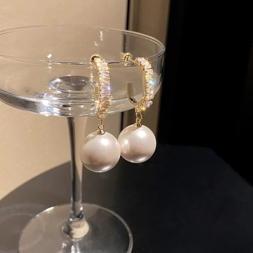 Eleganti auskari ar pērļiem un zirkoniem
